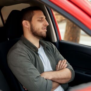 Is it legal to sleep in your car or carry a gun in your car?